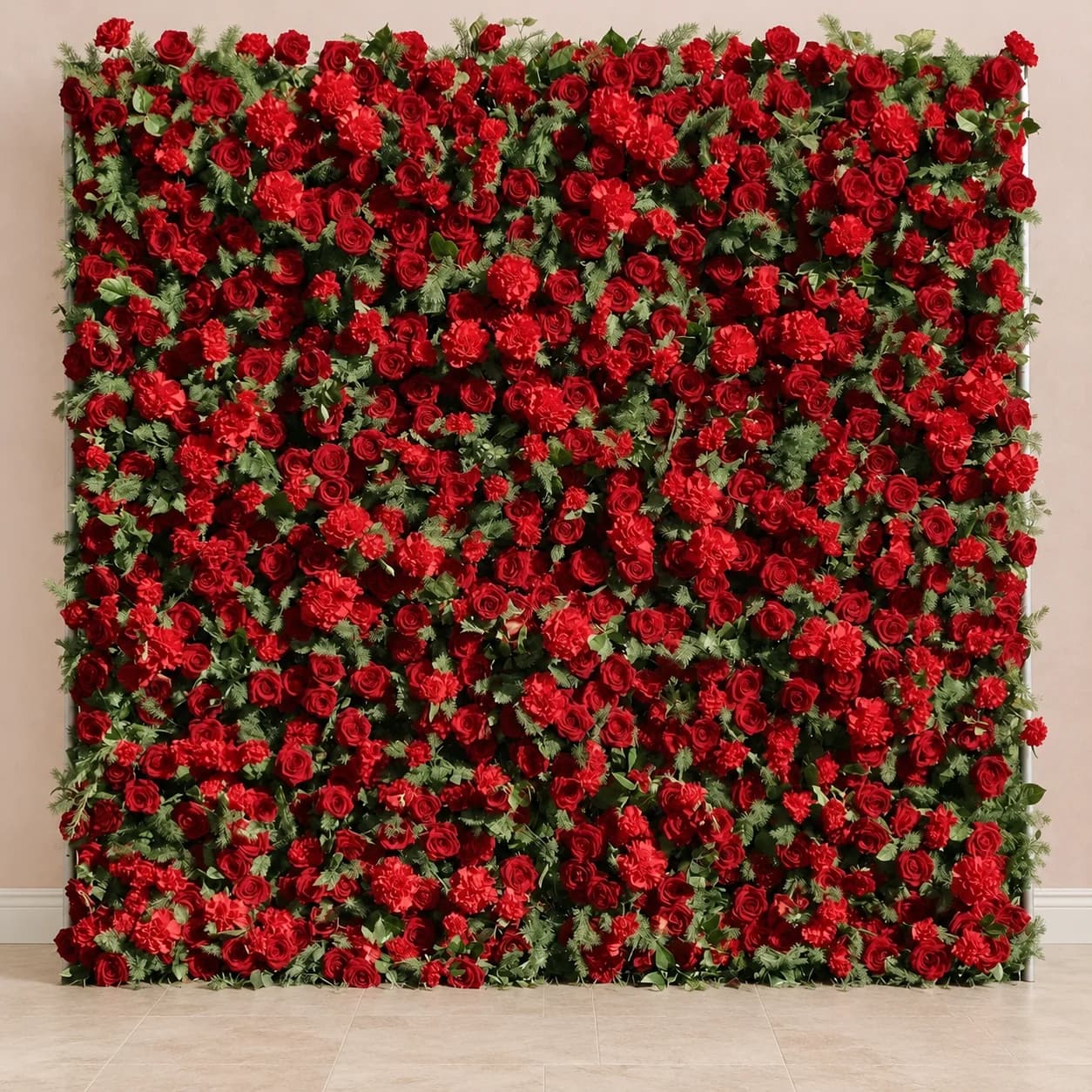 Dimensional red flower wall with roses and green foliage in an illustrative blush room